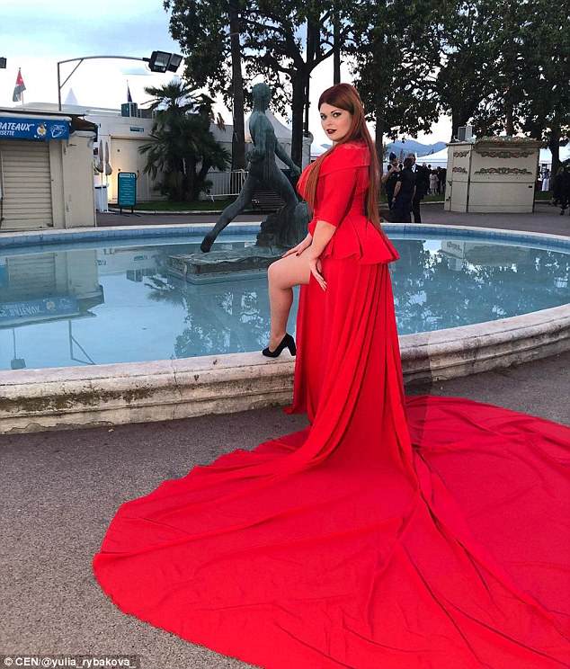 Plus-size model is left standing in her UNDERWEAR on Cannes red carpet after a passerby steps on her dress - but she's accused of 'faking it for fame' 