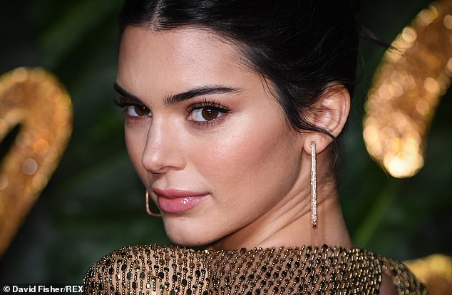 Kendall Jenner wears skimpy thong and no bra under daring sheer gold-beaded dress at star-studded event