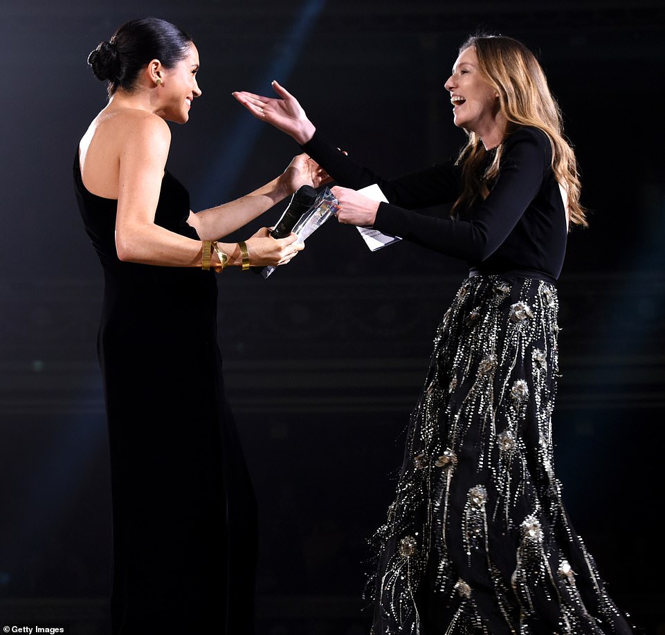 Duchess of Sussex STUNS onlookers in surprise appearance to honour wedding dress designer at Fashion Awards