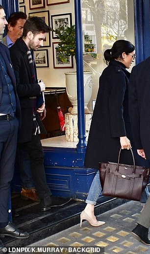 Meghan Markle dresses down and opts for casual blue jeans for informal lunch – but still goes for ‘dangerous’ high heels