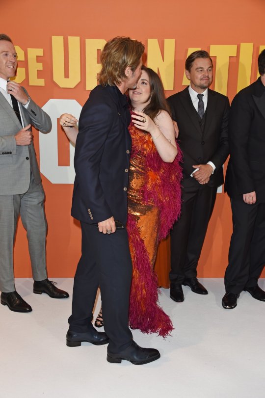 Actress Brad Pitt confused with a kiss after lifting her dress to show her underwear in front of him on the red carpet