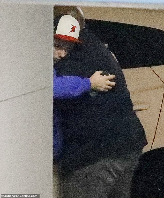 Justin Bieber hugs his bodyguard after getting back from solo spiritual retreat following the release of Selena Gomez's break-up track