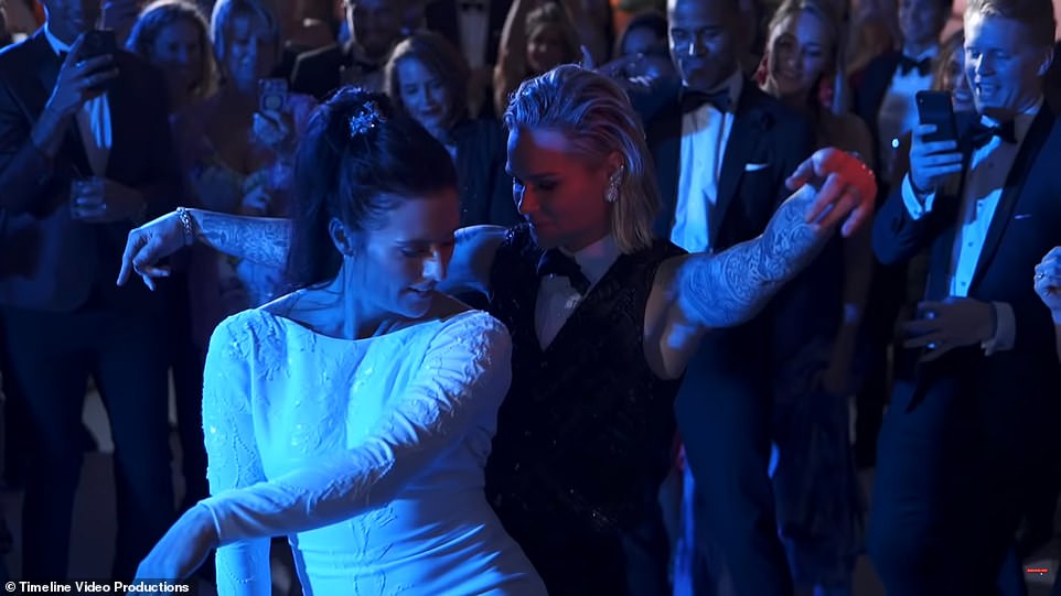 Having a ball! US soccer team stars Ashlyn Harris and Ali Krieger wow in tux and stunning white gown as they marry in 'Mediterranean castle' Miami ceremony