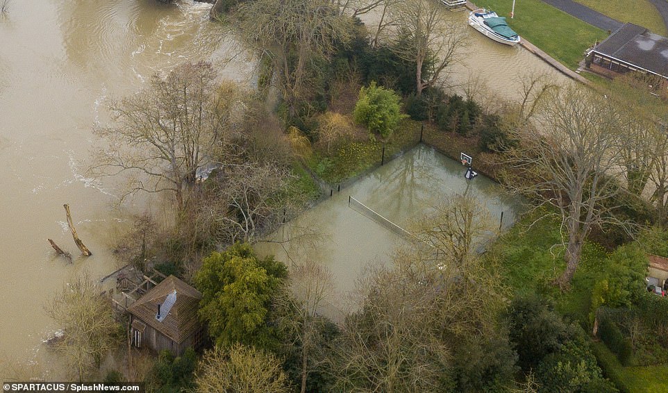 George and Amal Clooney's mansion is surrounded by flood water: £12m Grade-II listed home becomes submerged after Storm Dennis 